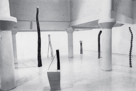 Installation view with Tall Chalk (1975), Leaning Chalk (1975), Stacked Lead (1976), Small Chalk (1975), Leaning Column (1975) and Oak Tree Column (1973), Garage Gallery, London, 1976